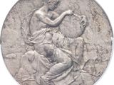 une vieille pièce d'argent sur laquelle figure la statue d'une femme tenant une cruche
