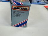 a box of matchbox toys sitting on a table