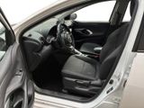 the interior of a car with the door open and the driver ' s seat down