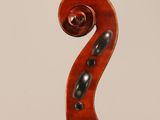 an old violin with a long neck and a long bow