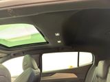a view of the sunroof of a car from the inside
