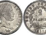 a close up of a coin with a woman ' s head on it