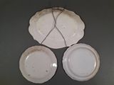 three plates that are sitting on a table