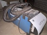 a machine that is sitting on the floor in the garage