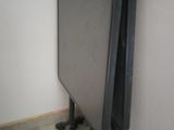 a small table that is sitting in the corner of a room