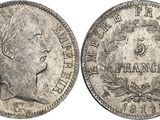 a silver coin with an image of a woman ' s head on it