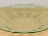 a glass bowl sitting on a wooden table