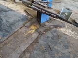 an image of a machine that is working on a piece of metal