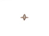 a close up of a diamond ring on a white surface
