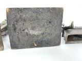 several pieces of metal sitting on top of a table next to each other