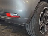 a close up of a car ' s rear end with a tire