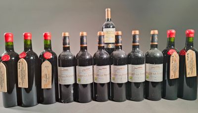 many bottles of wine that are lined up on the table
