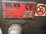 a red sign on the side of a machine