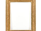 an antique gold frame with a white background