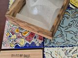 a wooden box with a picture on it sitting on a table