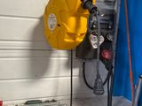 a hose attached to the side of a garage door