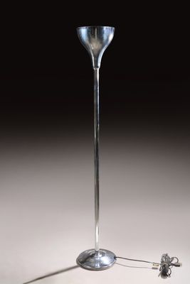 a silver floor lamp with a glass shade on it