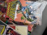 a lot of comic books sitting on a table