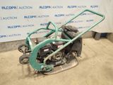 an image of a lawn mower sitting on the ground