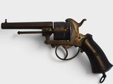 a close up of a revolver on a white surface