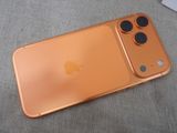 a close up of an iphone with a camera on top of it