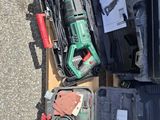 a box full of tools sitting on the ground