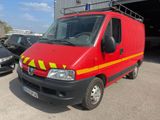 an image of a red van parked in a parking lot