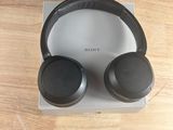 a pair of headphones sitting on top of a wooden table