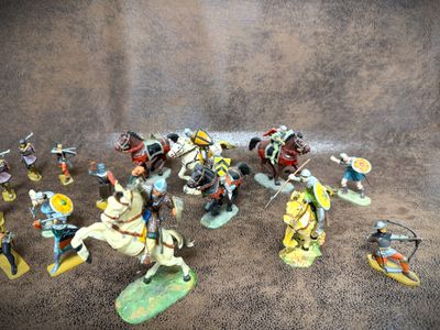a lot of figurines that are sitting on a table