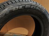 tire on a cardboard box with a cardboard box in the background