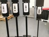 three black and white target stands in the middle of a room