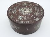 a brown box with a floral design on it