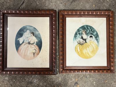 two framed pictures of a cat and a dog laying on top of each other