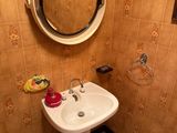 a bathroom with a sink and a mirror in it