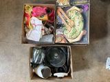 two boxes that have various items in them on the floor