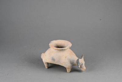 an image of a small vase with a cow on it