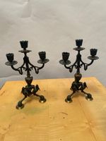 Paire de candélabres en bronze à trois bras de lumières.