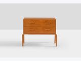a wooden chest of drawers with two drawers on each side and one drawer on the other side