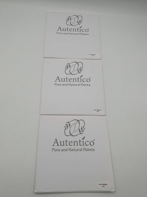 three white business cards with the logos of autentico and pure and natural paints