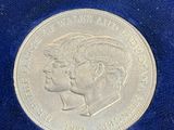 a close up of a coin on a blue cloth on a table