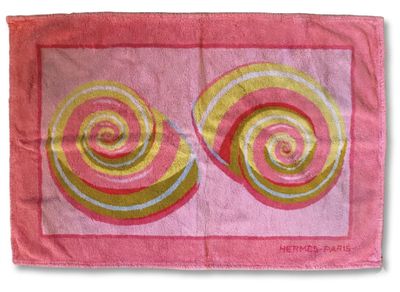 pink and yellow bath mat with two circles on it