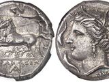 a silver coin with an image of a woman and a horse on it