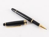 two black and gold fountain pens sitting on top of a white surface