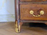 an image of a wooden chest of drawers on a hard wood floor