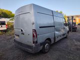 a silver van that is parked in a lot