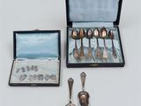 a box with silver spoons and spoon spoons and a box with silver spoons and spoons