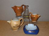 four different types of pottery on a table