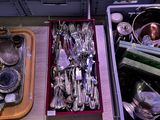 many different types of silverware in a box