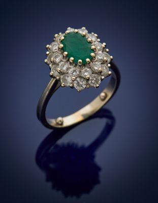 an emerald and diamond cluster ring