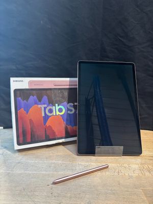an image of a tablet computer sitting on top of a wooden table